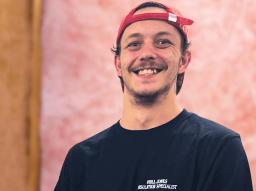 a man smiling at the camera