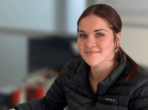 Woman sitting in an office environment.